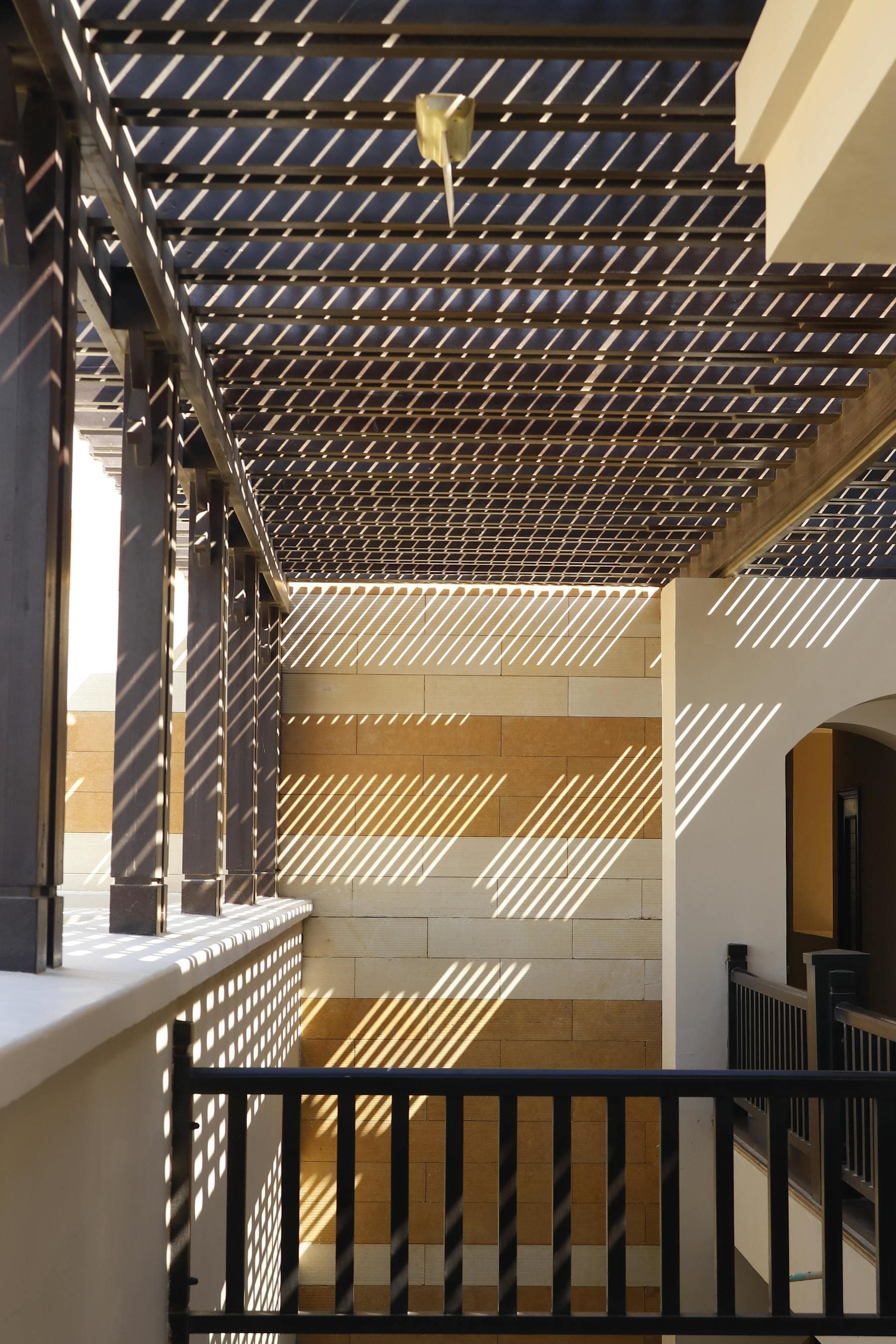 Minimal architectural interior with sunlight and shadow patterns
