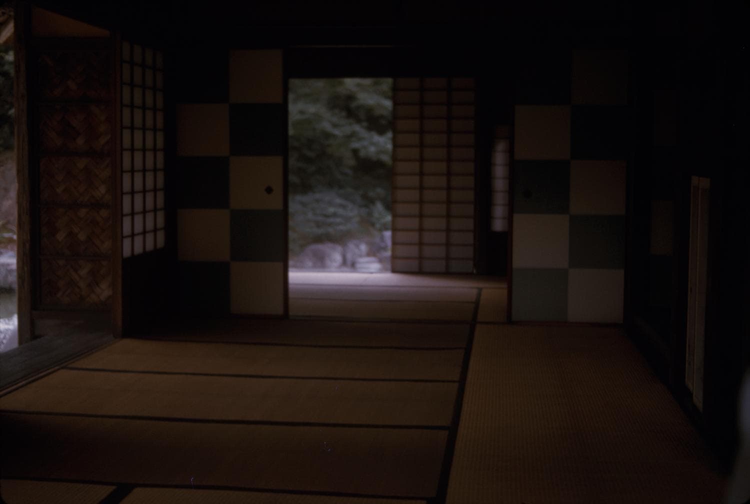 Shadowed timber and shoji interior with soft natural light